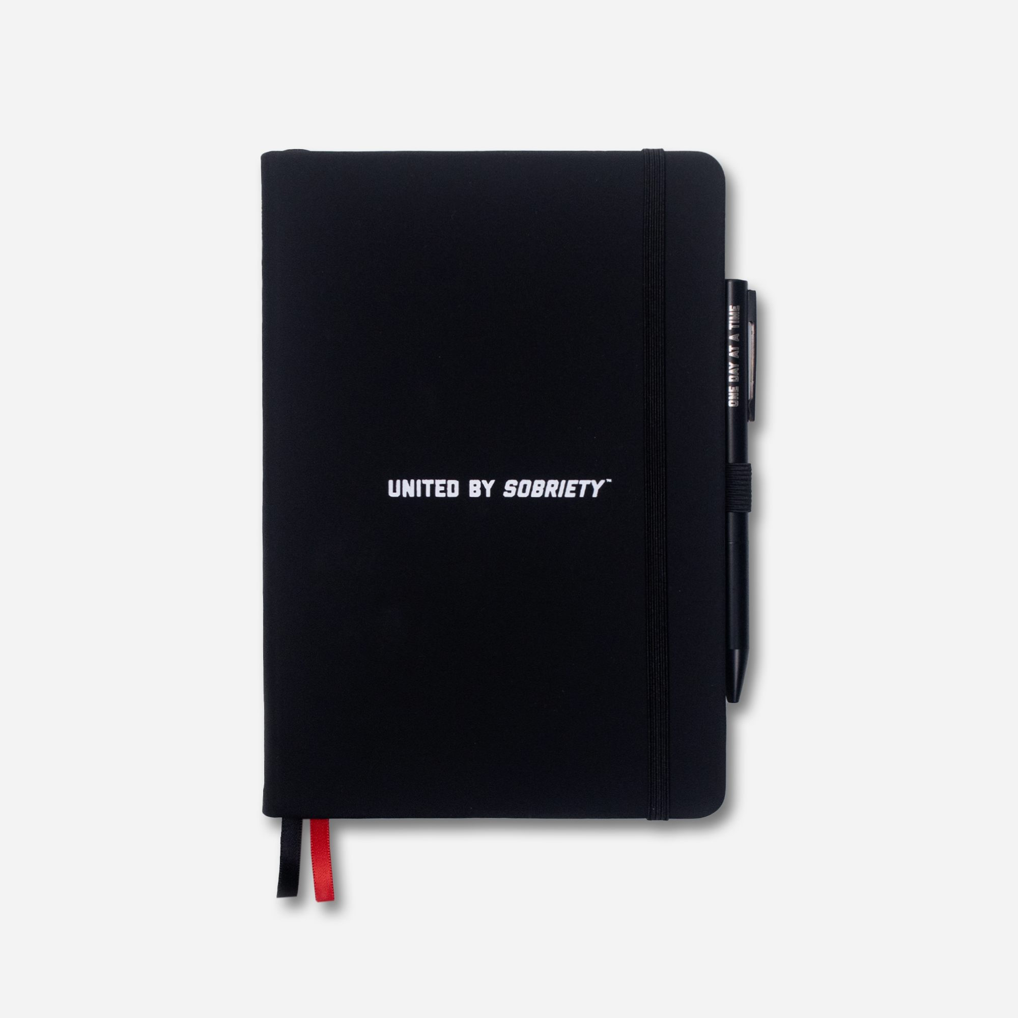 A black faux leather notebook with the text 'UNITED BY SOBRIETY' -United HeadWear